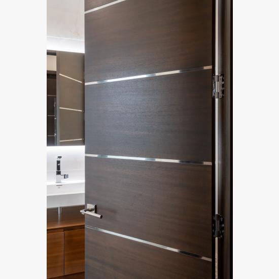 TMIR6000 doors in mahogany with ½" bright stainless steel inlays. Customer stained finish.