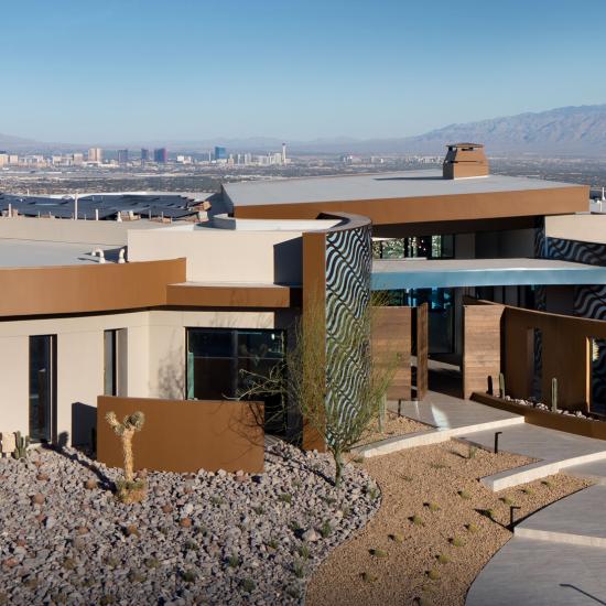 Exterior shot of the 2020 NAHB New American Home by Sunwest set in the mountains outside of Las Vegas, overlooking the strip.