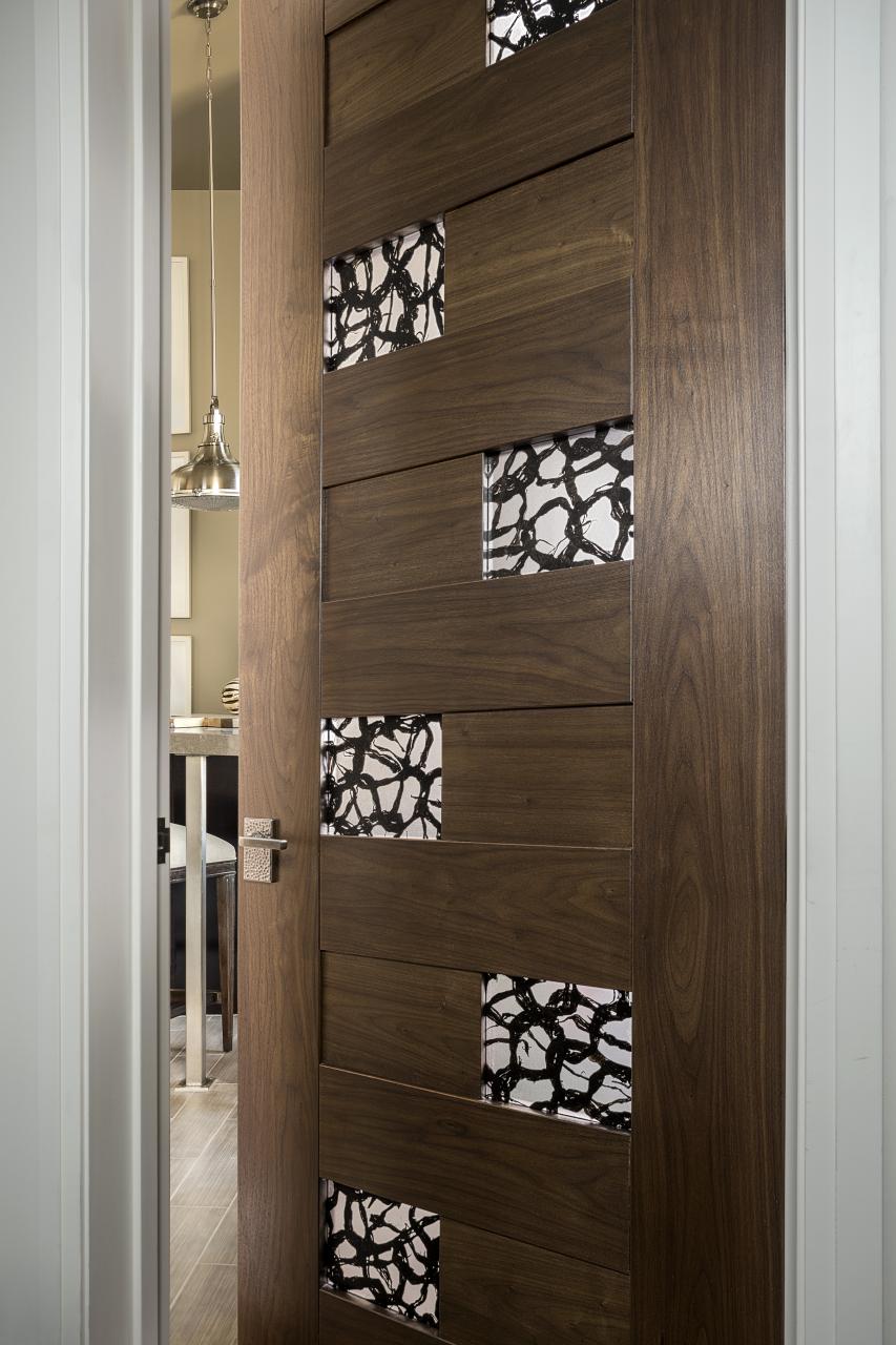 TM13420 in walnut with 3Form® Ponder Dark resin (discontinued) is a focal point in the hallway.