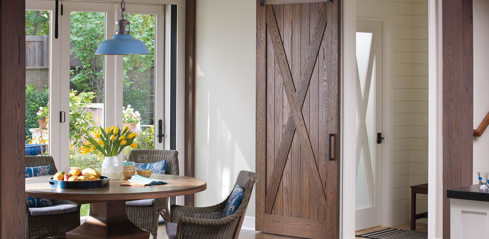 Breakfast nook with rustic barn door