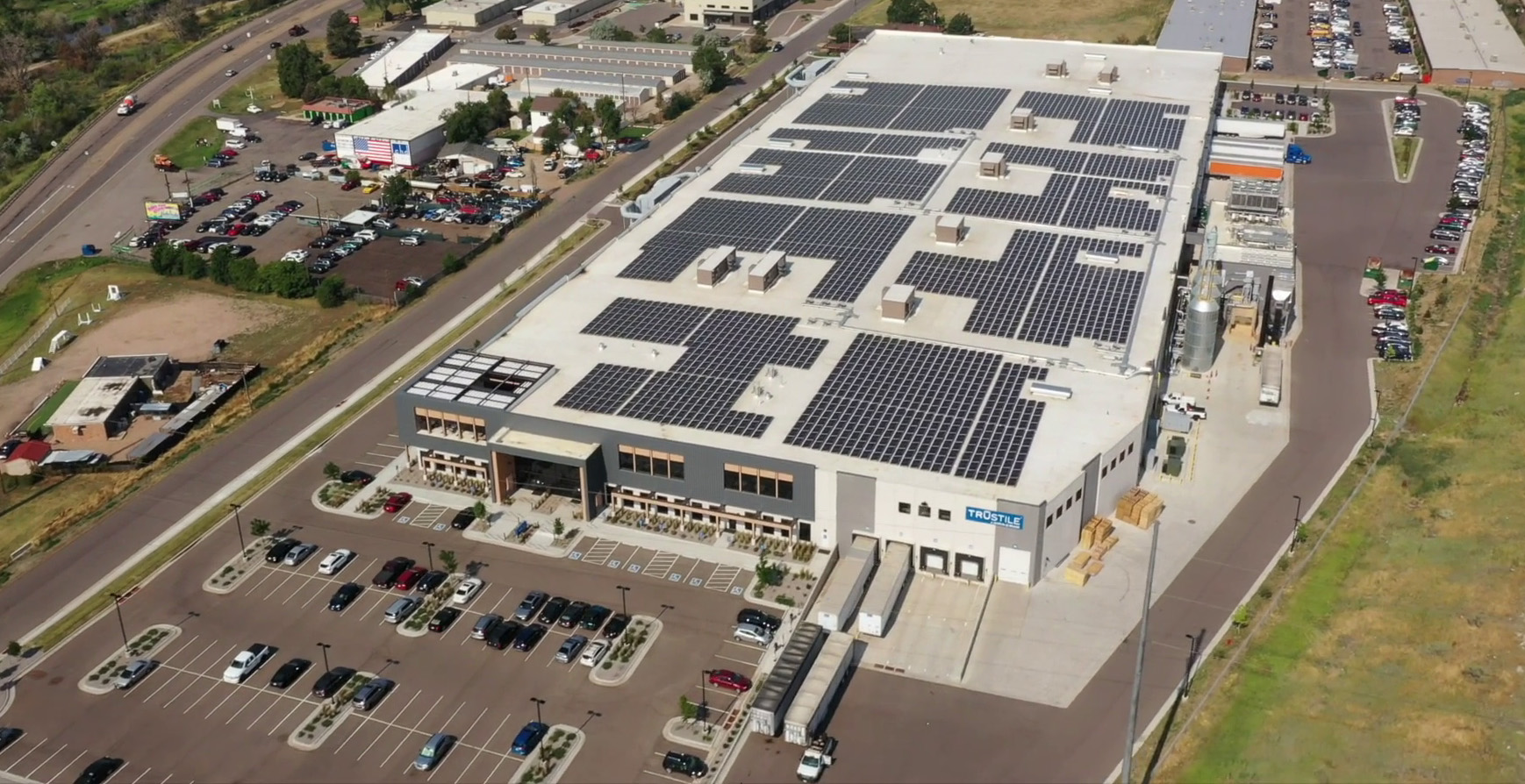 Aerial photo of TruStile plant in Denver showing array of solar panels on the roof