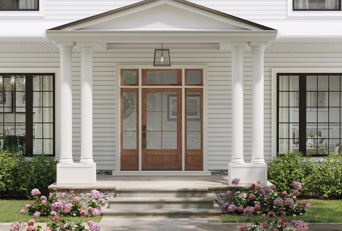 front of house with traditional style door entry system with glass interior sidelites and transom