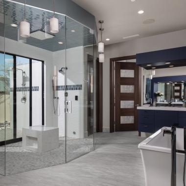 A contemporary master bath features TM9160 doors in walnut with Nutmeg stain and Capiz resin.