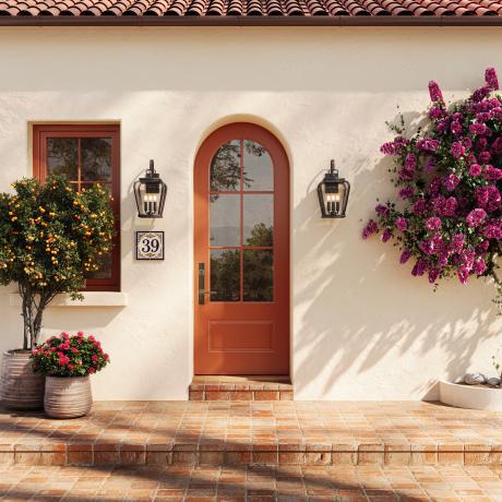 Radius-top Resilient FL619-ES401 entry system with clear glass on a Mediterranean-style home.