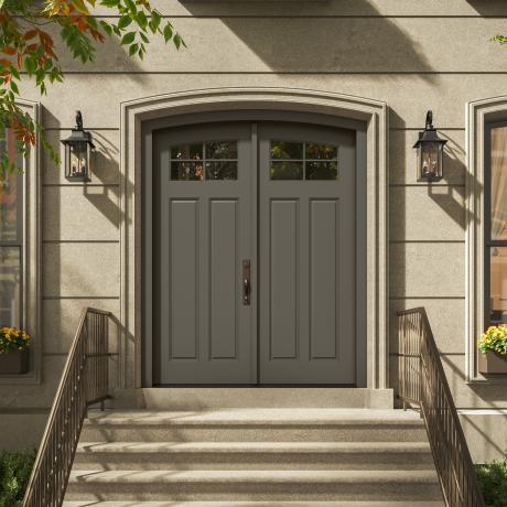 PL254-ES501 Resilient Wood Entry System with Cove & Bead sticking, Scoop panels, and clear glass, featured as a traditional double-door entrance with stone surrounds and decorative lanterns.