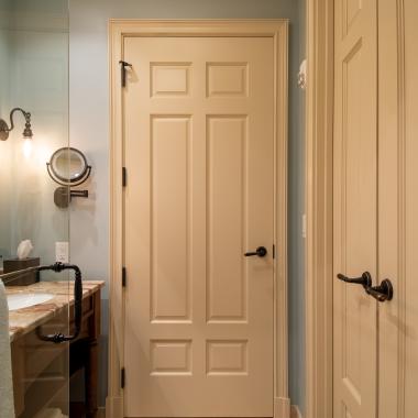 Bathroom with TS650 in MDF with Roman Ogee (OG) sticking and Scoop (B) panel. Pair of TS3100 doors to right.