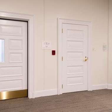 Custom fire-rated door in MDF with fire glass, Bolection (BM) moulding and Senior Raised (E) panel.