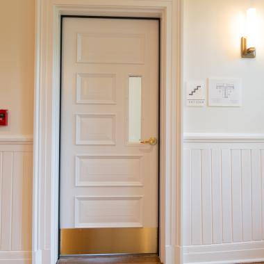 Custom fire-rated door in MDF with fire glass, Bolection (BM) moulding and Senior Raised (E) panel.