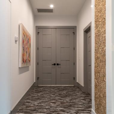 A pair of TM9420 doors in MDF open to the master bedroom.