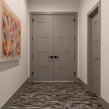 A pair of TM9420 doors in MDF open to the master bedroom.