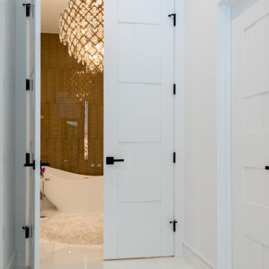 This modern master bath features TM9420 doors in MDF with flat panel inserts.