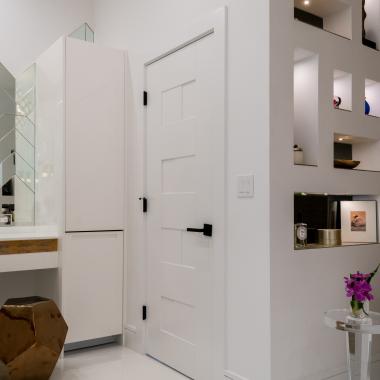 This modern master bath features TM9420 doors in MDF with flat panel inserts.