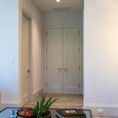 A pair of TS1000 doors, in MDF with Miracle (MR) moulding and flat (C) panel, provide privacy for the family room.