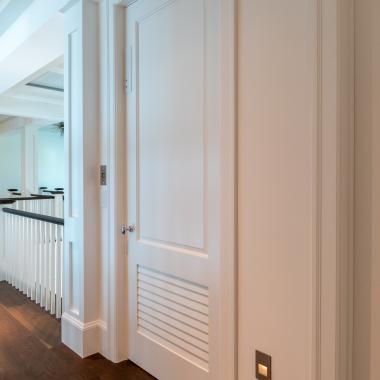 The elevator on this coastal home features a TS2060 in MDF with Roman Ogee (OG) sticking and Raised (A) panel. The bottom panel has been switched to a false louver panel.