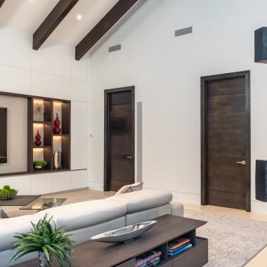 Family room with TMIR3080 doors in quarter sawn white oak with ¼" kerf cut reveals. Builder provided stain finish.