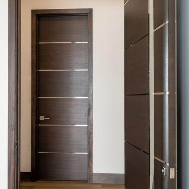 TMIR6000 doors in mahogany with ½" bright stainless steel inlays. Customer stained finish.