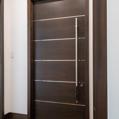 TMIR6000 doors in mahogany with ½" bright stainless steel inlays. Customer stained finish.