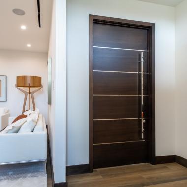 TMIR6000 doors in mahogany with ½" bright stainless steel inlays. Customer stained finish.