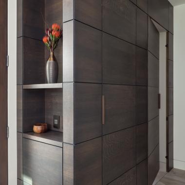 This cabinet features carefully concealed TMIR5000 doors in rift sawn white oak with Espresso stain and ¼" kerf cut reveal