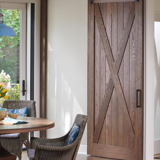 Breakfast nook with rustic barn door