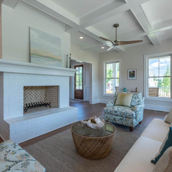 A large living room offers a view of a FL810 entry door in Cherry with Hazelnut finish.