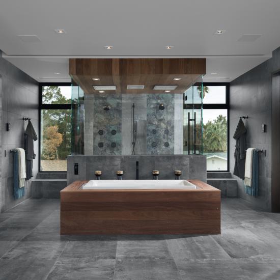 Master bath features TMF1000 flush doors in walnut with Ebony stain.