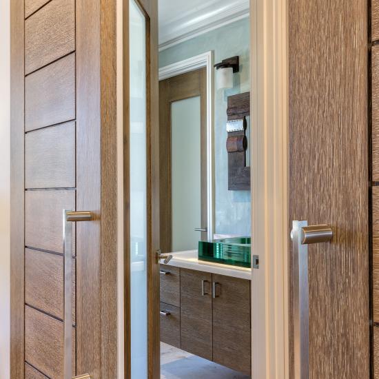 Pair of TM13000 barn doors in white oak with custom ceruse finish (TM1000 in background)