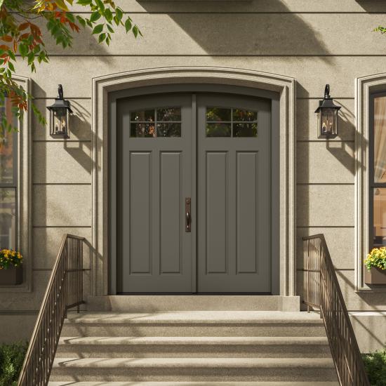 PL254-ES501 Resilient Wood Entry System with Cove & Bead sticking, Scoop panels, and clear glass, featured as a traditional double-door entrance with stone surrounds and decorative lanterns.