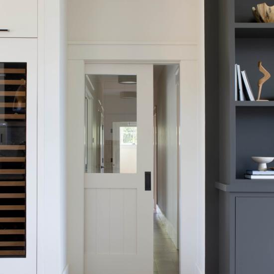 VG2100 pocket door in MDF with Square Stick (SS) sticking, V-groove panel and top panel replace with clear glass.
