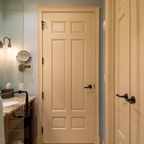 Bathroom with TS650 in MDF with Roman Ogee (OG) sticking and Scoop (B) panel. Pair of TS3100 doors to right.