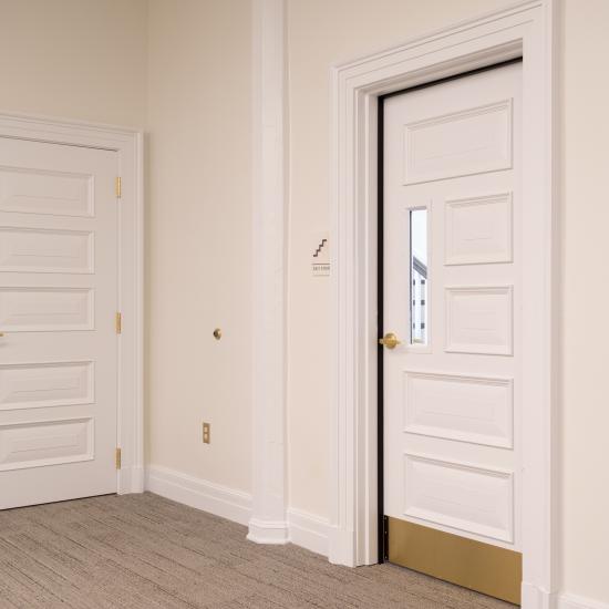 Custom fire-rated door in MDF with fire glass, Bolection (BM) moulding and Senior Raised (E) panel.