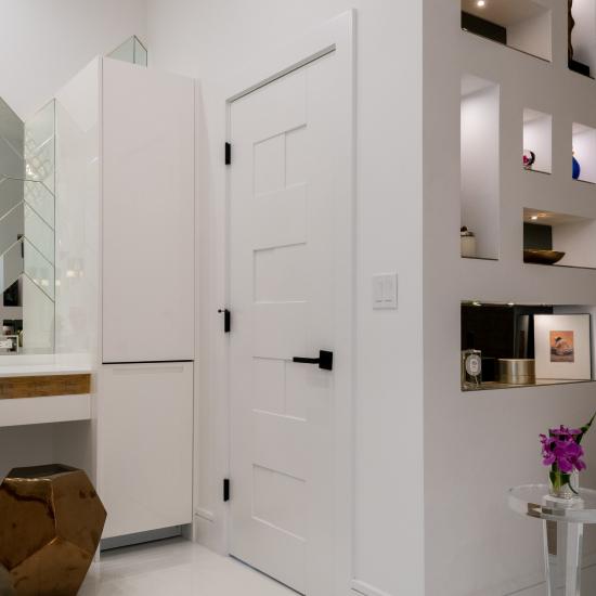 This modern master bath features TM9420 doors in MDF with flat panel inserts.