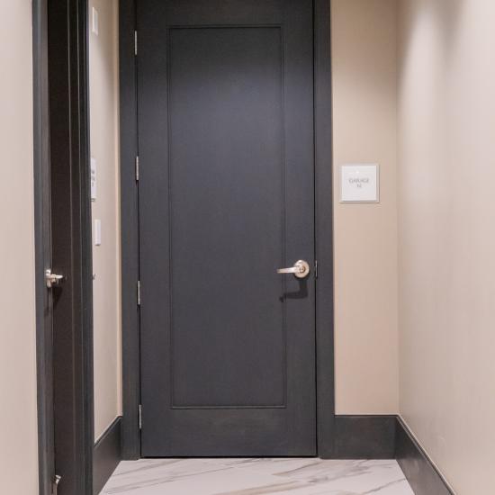 Condominium tower featuring TS1000 doors, in rift sawn white oak with Quirk (QM) moulding and Flat (C) panel in lobby.