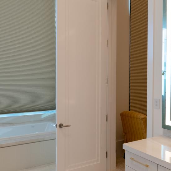 This master bath features monumental 10' tall TS1000 doors in MDF with Miracle (MR) moulding and Flat (C) panel.