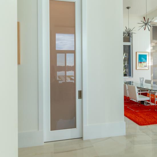 Powder room featuring TS1000 in MDF with One Step sticking and White Lami glass.