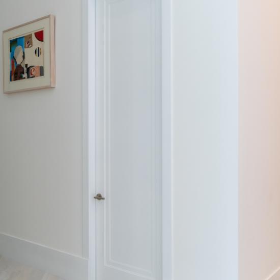 This home features 10' tall TS1000 doors in MDF with Miracle (MR) moulding and Flat (C) panel.