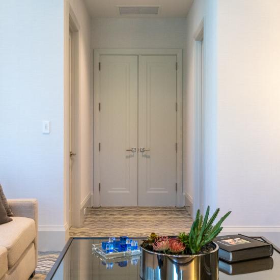 A pair of TS1000 doors, in MDF with Miracle (MR) moulding and flat (C) panel, provide privacy for the family room.