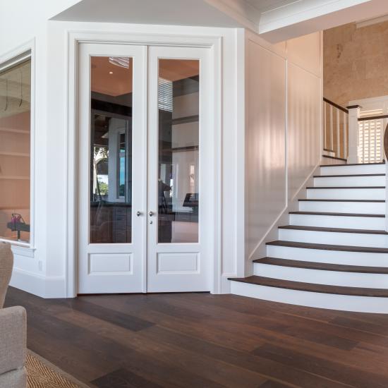 A study next to the living room features a pair of FL110 doors in MDF with Roman Ogee (OG) sticking, Raised (A) panel and clear glass.