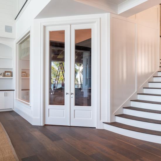 A study next to the living room features a pair of FL110 doors in MDF with Roman Ogee (OG) sticking, Raised (A) panel and clear glass.