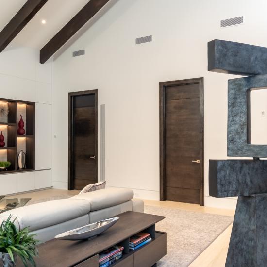 Family room with TMIR3080 doors in quarter sawn white oak with ¼" kerf cut reveals. Builder provided stain finish.