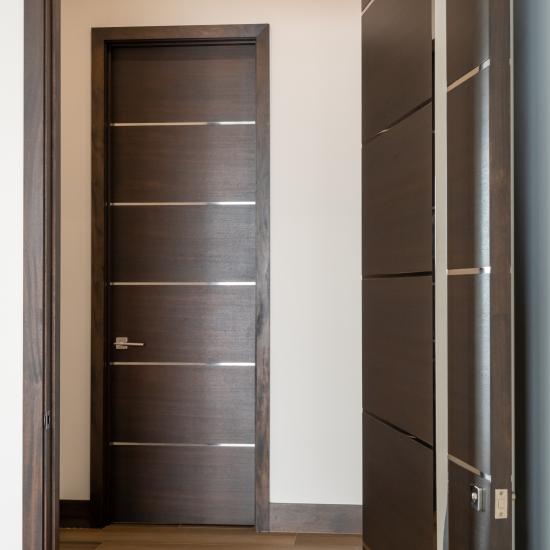 TMIR6000 doors in mahogany with ½" bright stainless steel inlays. Customer stained finish.