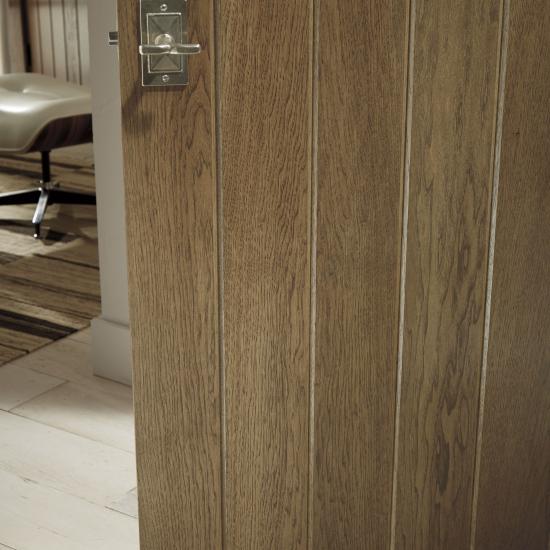 Detail of hickory plank door (VG1000) with wide V-groove profile and Cappuccino handwiped stain