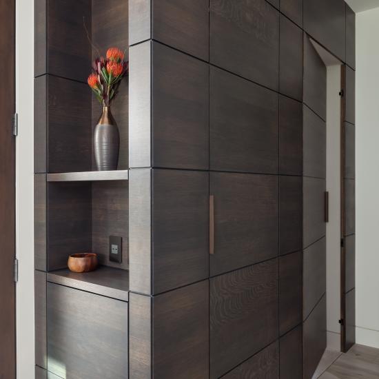 This cabinet features carefully concealed TMIR5000 doors in rift sawn white oak with Espresso stain and ¼" kerf cut reveal