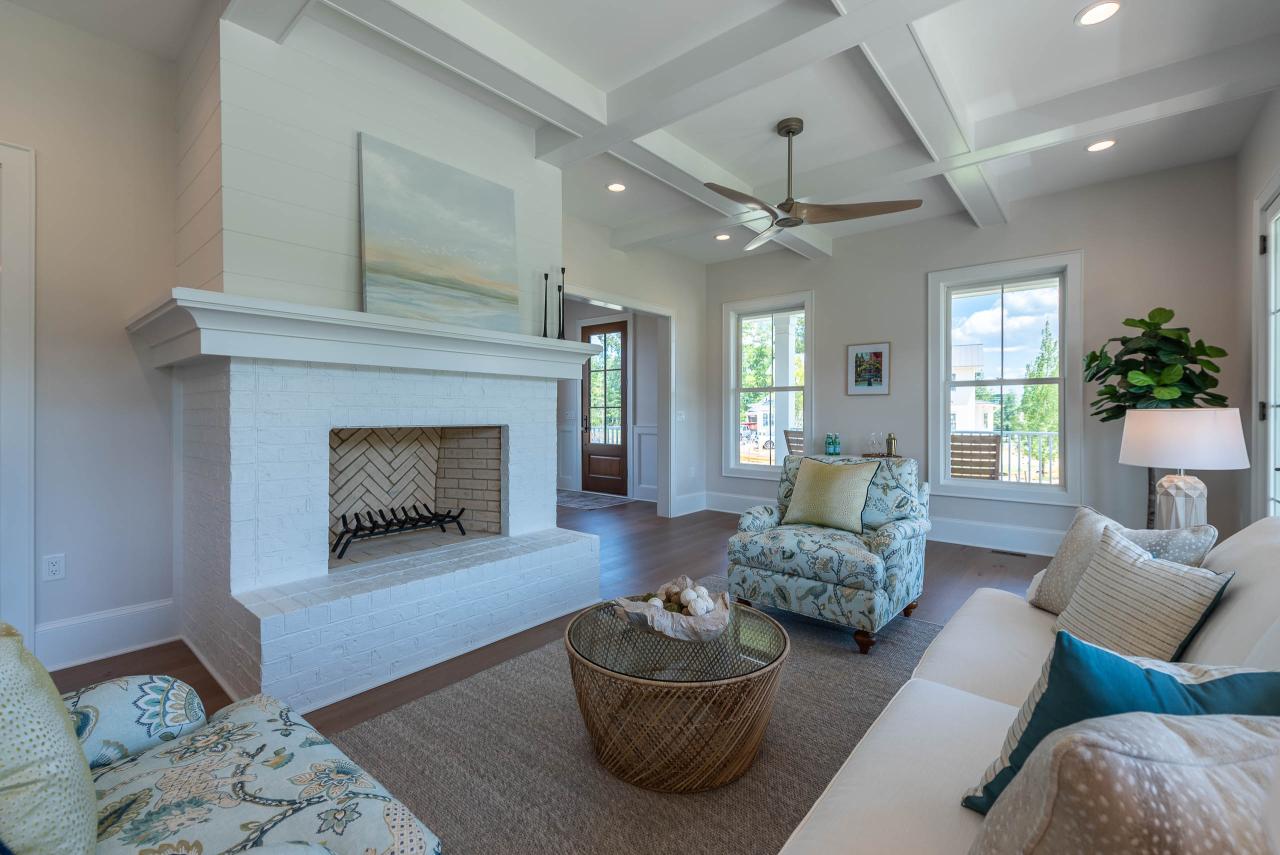 A large living room offers a view of a FL810 entry door in Cherry with Hazelnut finish.