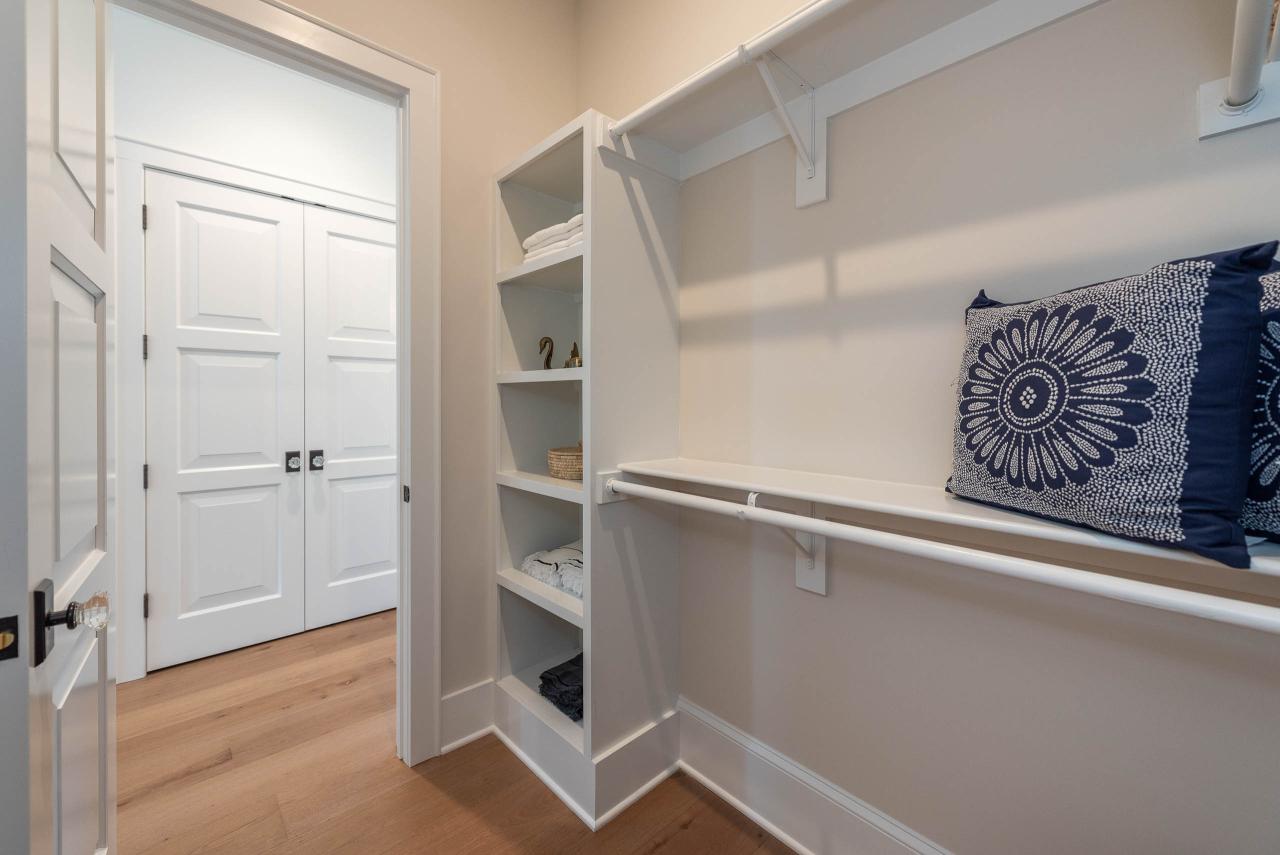 The heavy swing weight of these TS3000 doors, in MDF with Bevel (BV) sticking and Senior Bevel (F) panel, brings a feeling of quality to a walk-in closet.