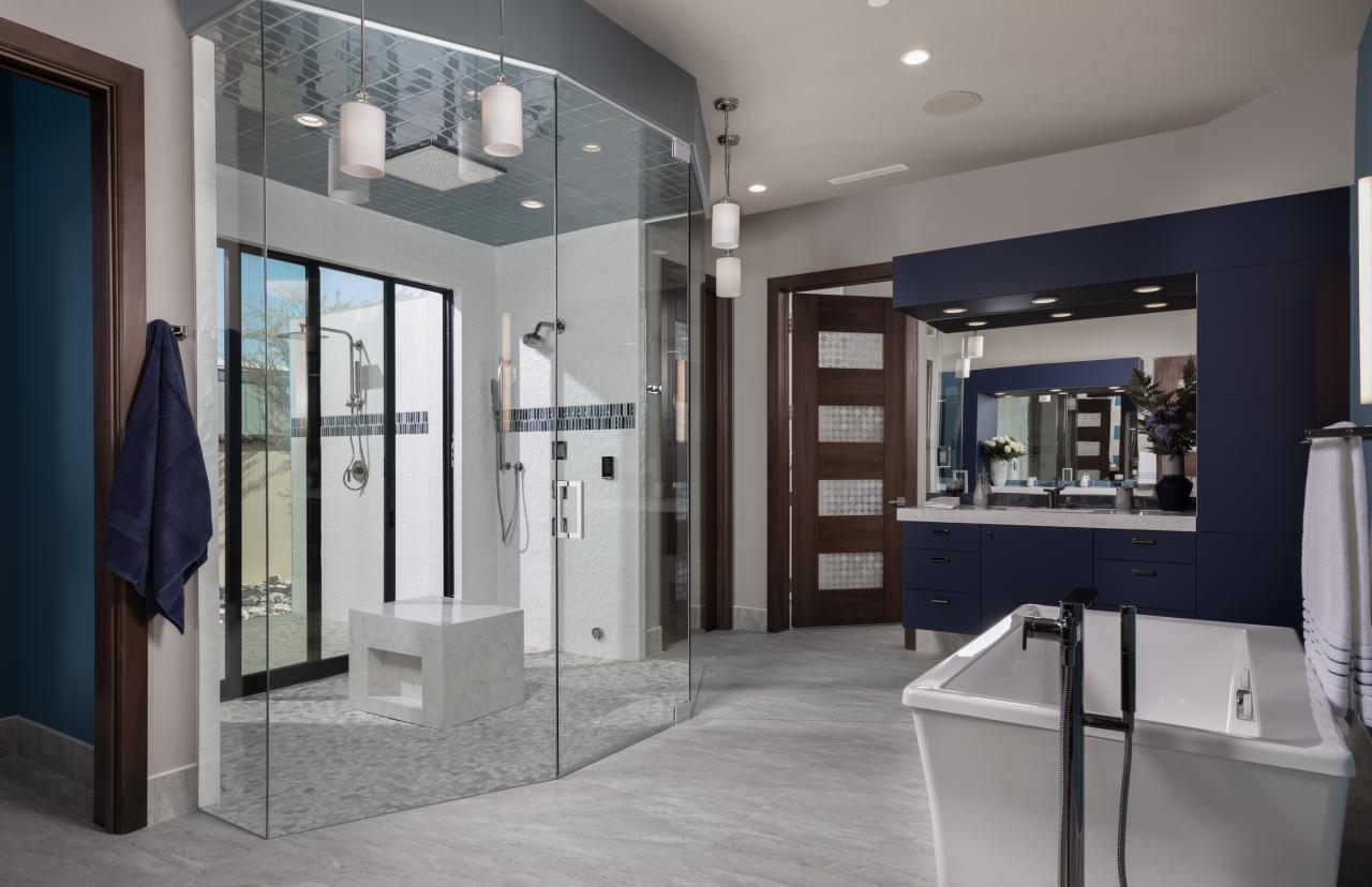 A contemporary master bath features TM9160 doors in walnut with Nutmeg stain and Capiz resin.