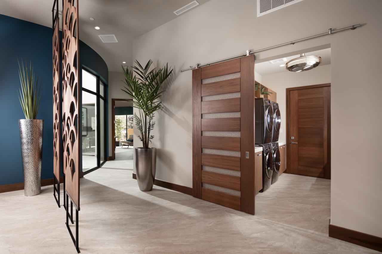 A TM9350 in walnut with Nutmeg stain and Bamboo Rings resin conceals the laundry room from the dining room. TM9000 in back.