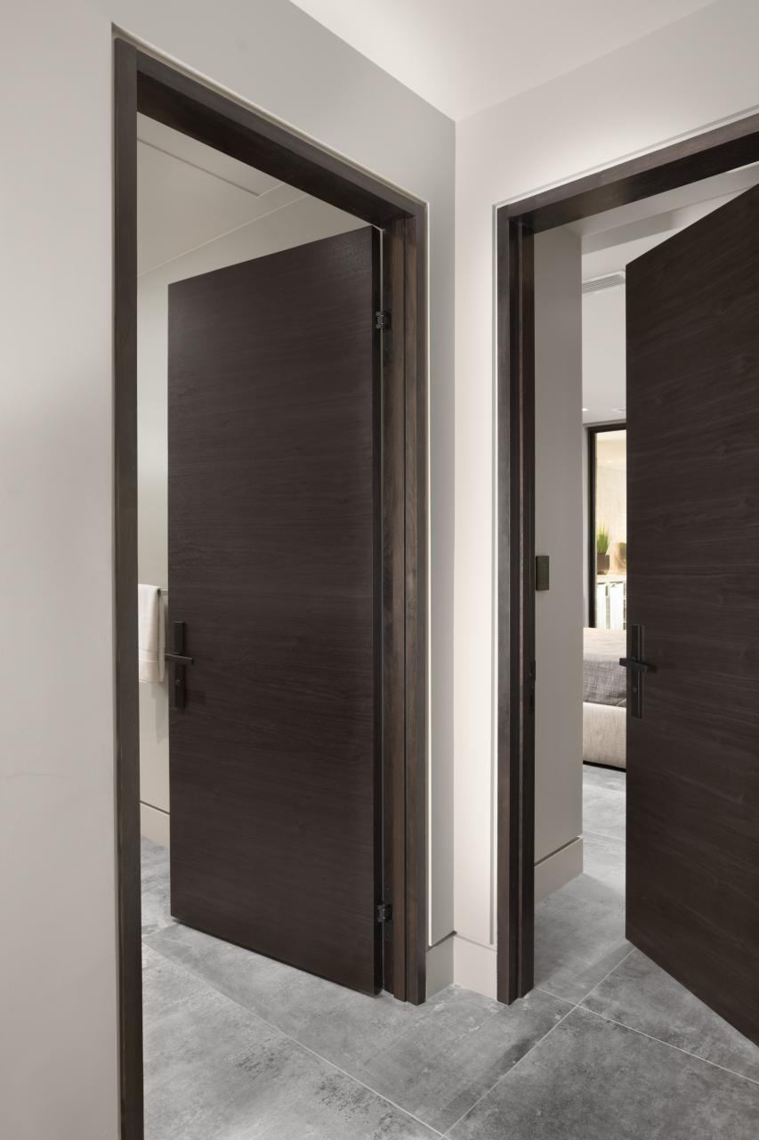 TMF1000 hallway doors in walnut with Ebony stain. Note the kerfed drywall detail around the modern TruStile jambs.