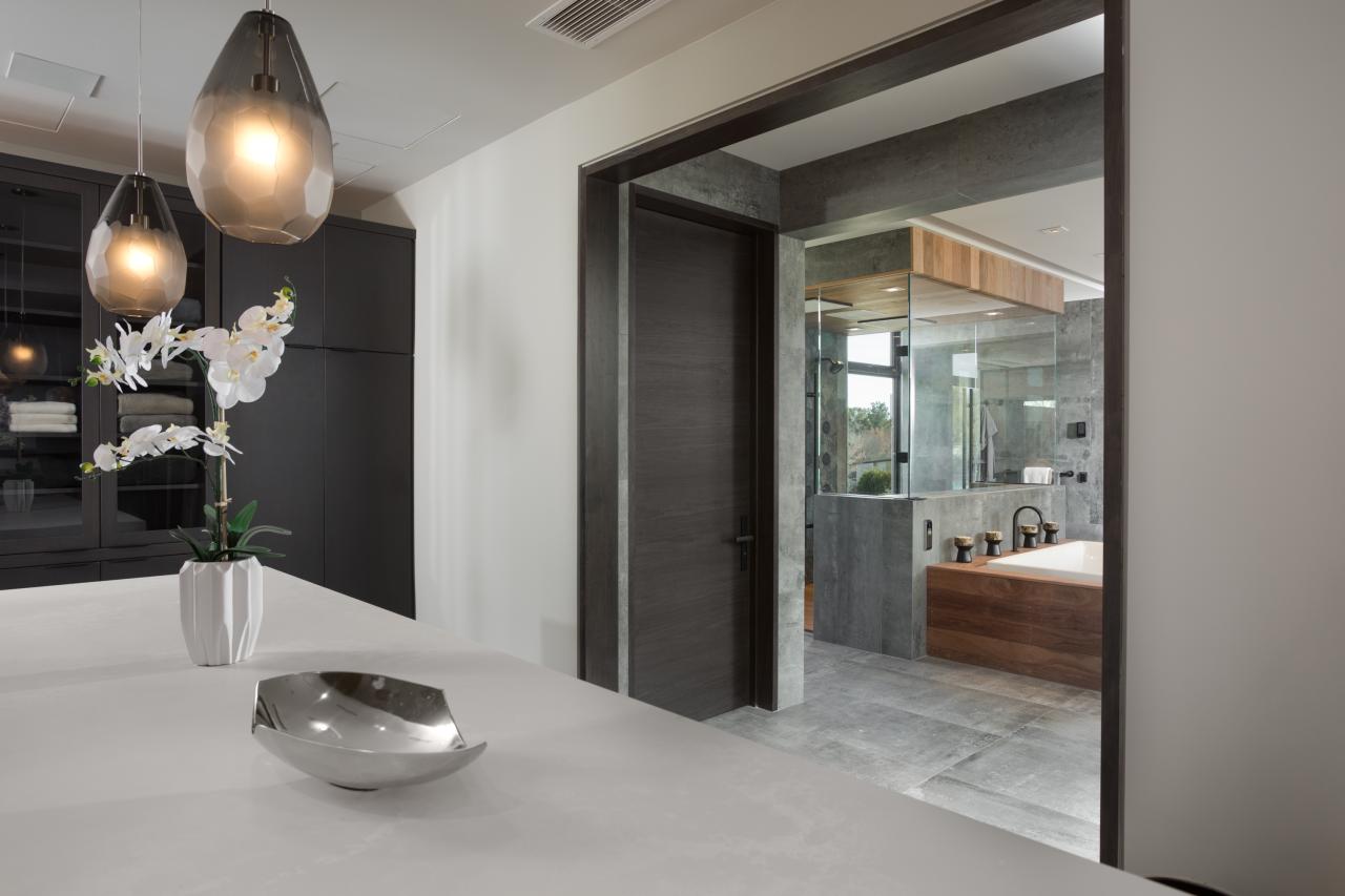 TMF1000 flush barn door, in walnut with Ebony stain, separated the master bath from a walk-in closet.