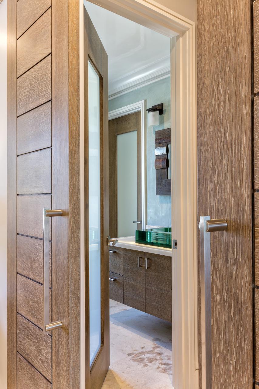 Pair of TM13000 barn doors in white oak with custom ceruse finish (TM1000 in background)